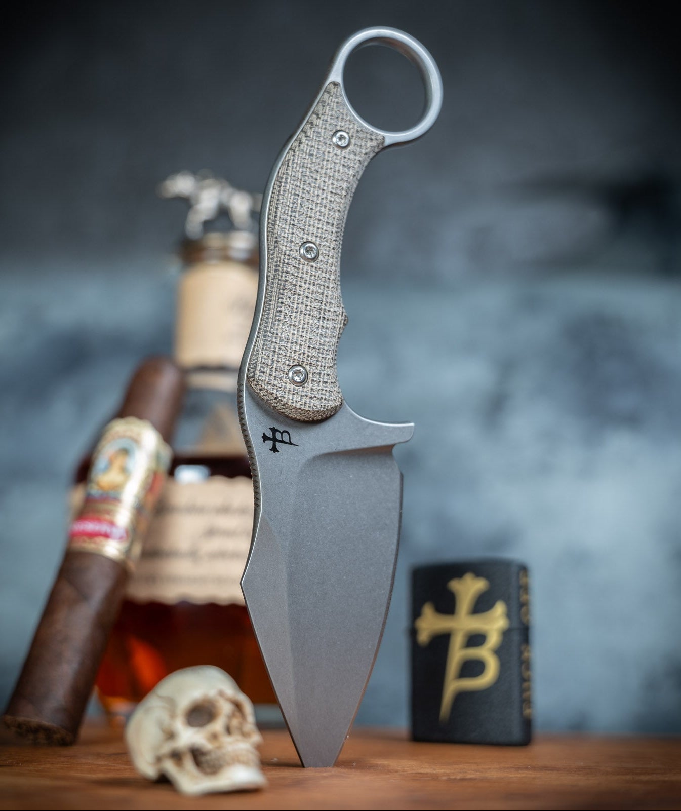 A fixed blade knife with a stonewash 3.6" blade and micarta handle